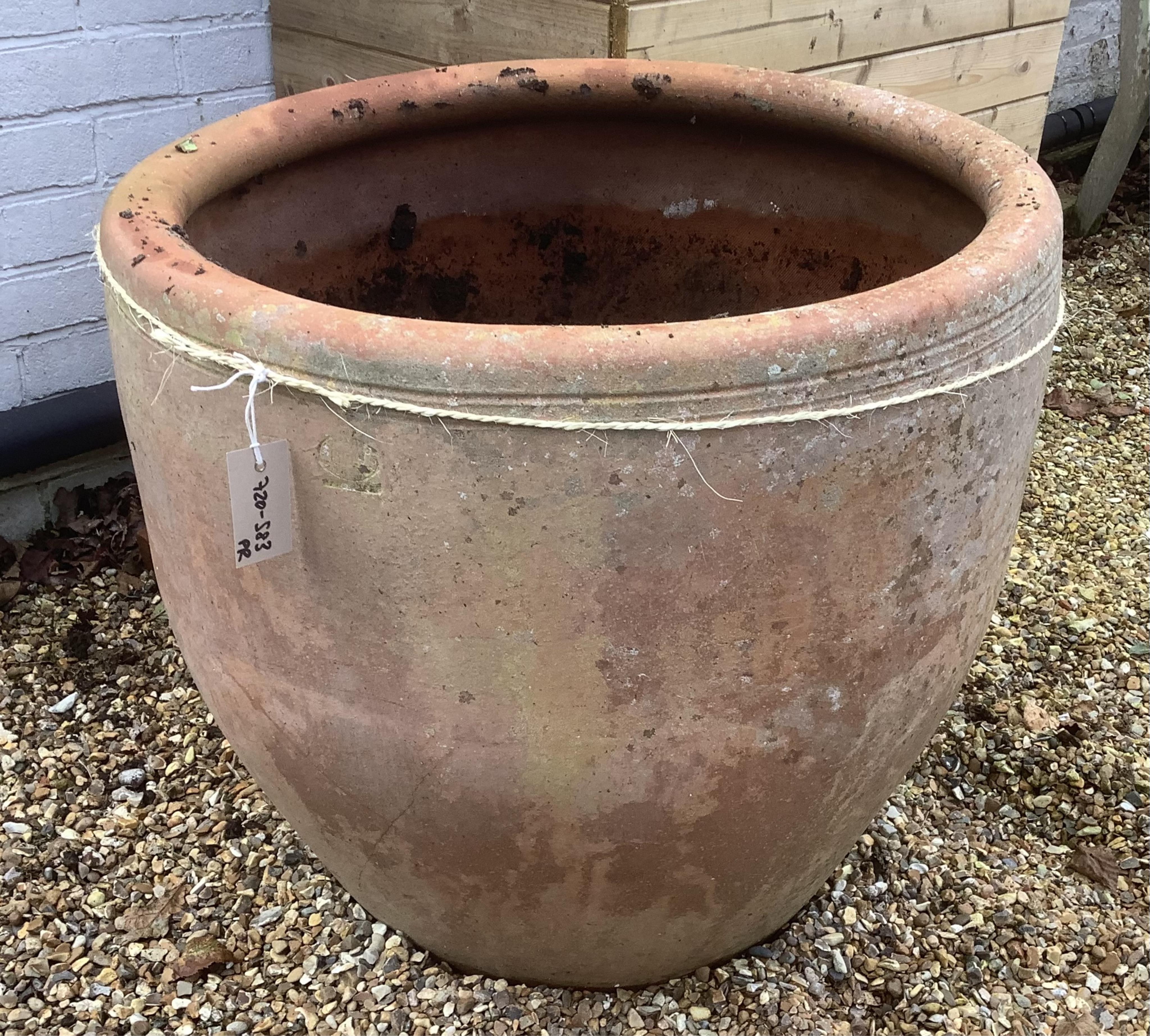 A pair of large terracotta planters, height 72cm, width 62cm. planting removed. Condition - weathered, otherwise good